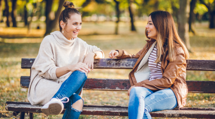 Forget Google, Ask a Mom Two moms talking on a park bench.