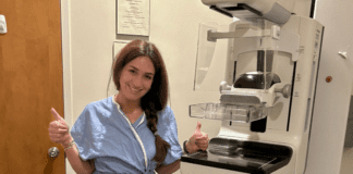 Breast Cancer Awareness – A Millennial Mom’s Lessons Learned A woman getting a mammogram.