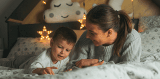 Falling Back While Staying Happy A woman in bed with her son at night.