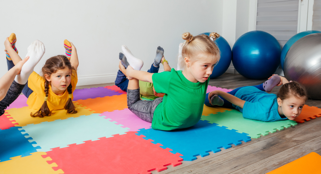 Kids exercising in a class. 