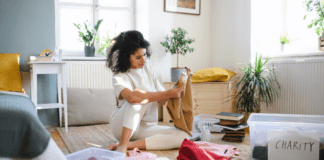 A woman clearing out her childhood bedroom.