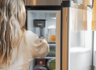 A woman looking in the refrigerator.