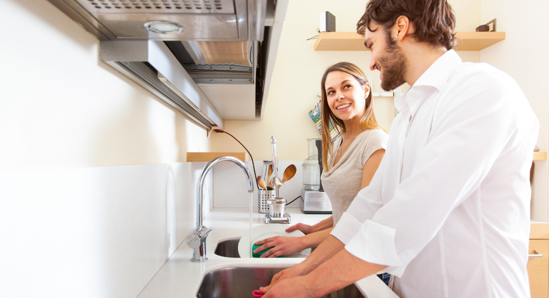 Sharing the mental load with a husband and wife doing the dishes.