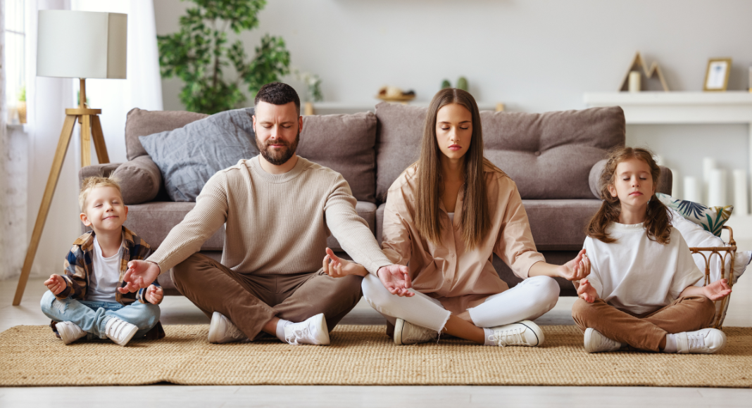 A family meditating together.