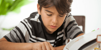 Our Journey with Dyslexia: Trusting My Instincts as a Mom A boy reading a book.
