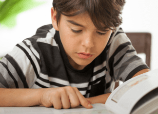 A boy reading a book.