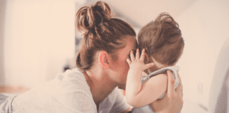 Embracing the Title of Mom: Meet Rebecca A mother kissing her baby.