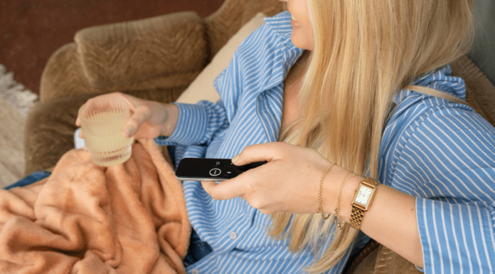 Why Moms Love True Crime: A Busy Mom’s Guilty Pleasure A woman watching true crime.