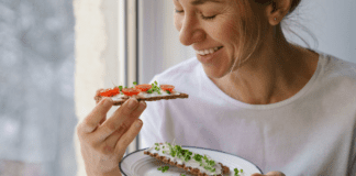 Healthy Swaps for Family Favorites (That Even Kids Will Love!) A woman eating a healthy snack.