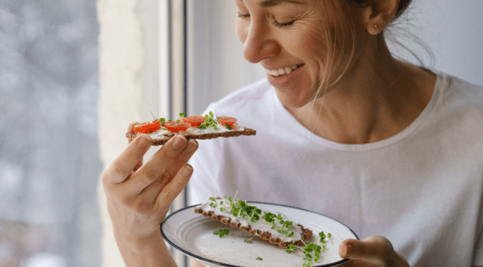 Healthy Swaps for Family Favorites (That Even Kids Will Love!) A woman eating a healthy snack.
