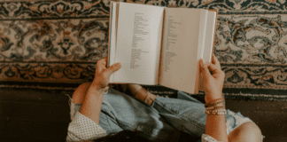Poetry: To Read or Not to Read Someone holding a book of poetry.