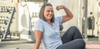 A strong woman making a muscle.