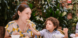Where to Eat, Drink, and Be Merry on Mother’s Day Son Feeding Mother