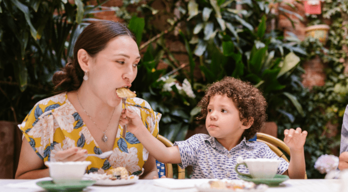 Where to Eat, Drink, and Be Merry on Mother’s Day Son Feeding Mother