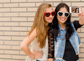 It’s a Girl’s World Trendy teen girls taking a selfie.