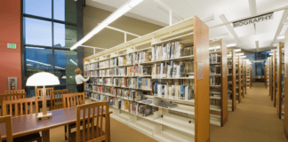 Thank You for Libraries Day A library full of booshelves.