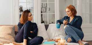 A Reason, Season, or Lifetime Two women talking on the couch.