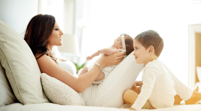 The Second Time Around: A Double-Edged Baby Spoon A mom with her baby and son.