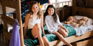 Maine Camps: A Life-Changing Experience Girls in a bunk at Maine Camps.