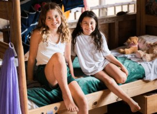 Maine Camps: A Life-Changing Experience Girls in a bunk at Maine Camps.