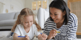 Au Pairs: Do I Really Want a Stranger Living in My Home? An au pair teaching a little girl.