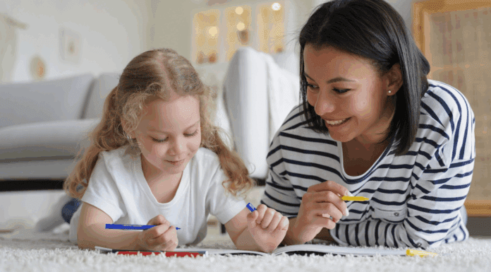 An au pair teaching a little girl.