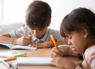 Children writing a book