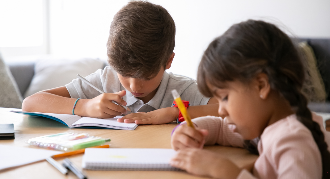 Children writing a book