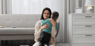 Motherhood, Mental Health, & Me A stressed mom hugging her son.
