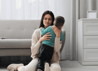 Motherhood, Mental Health, & Me A stressed mom hugging her son.