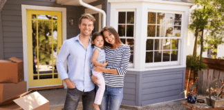 To Move or Not to Move? A family standing outside of their new home.