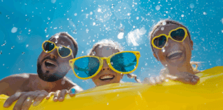 A family having fun int he water with a float.