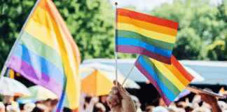 Have Pride Celebrating Pride Month with flags.