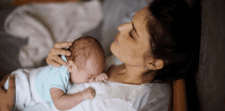 A mother holding her baby after birth.
