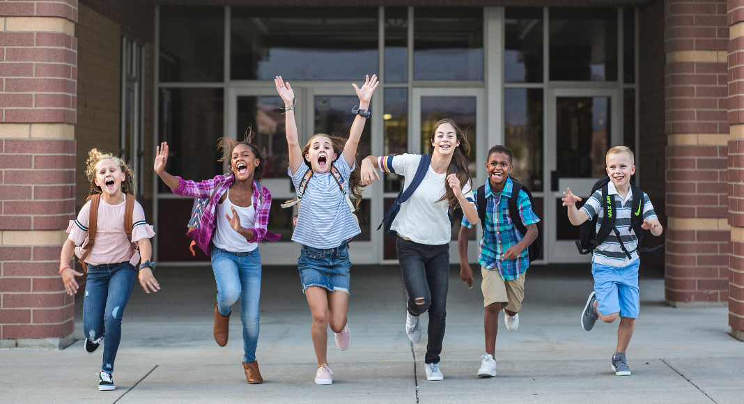 Kids running out of school.