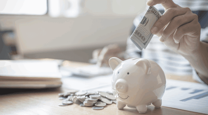 Your Mama Money Guide: Preparation for Any Financial Emergency Putting money in a piggy bank.