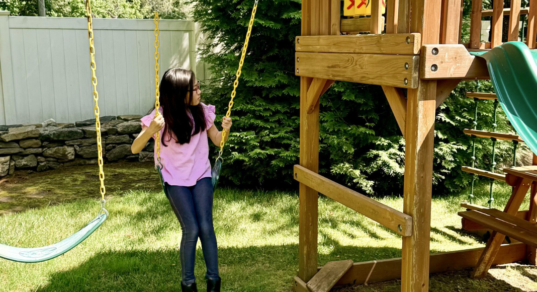 A girl on a swing.