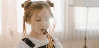 A girl playing an instrument.