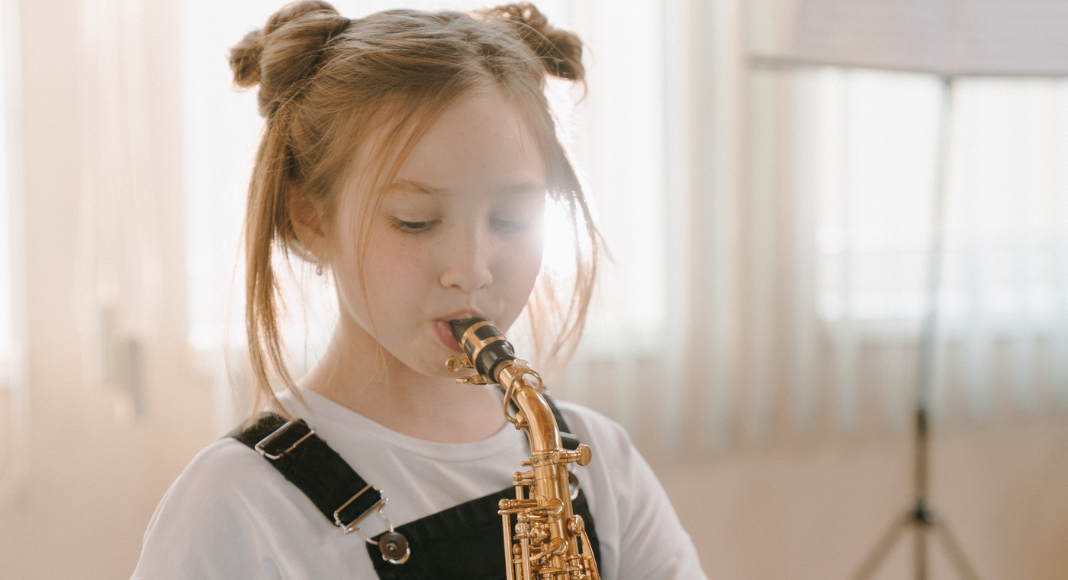 A girl playing an instrument.