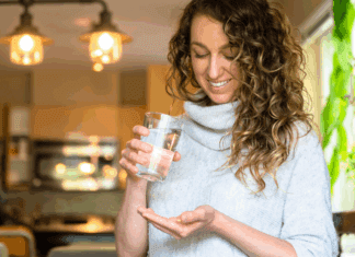 Magnesium Is Having a Moment A woman taking a magnesium pill.