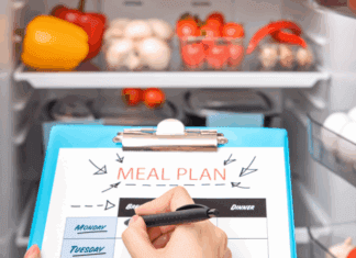 Looking into the fridge for writing a meal prep list.