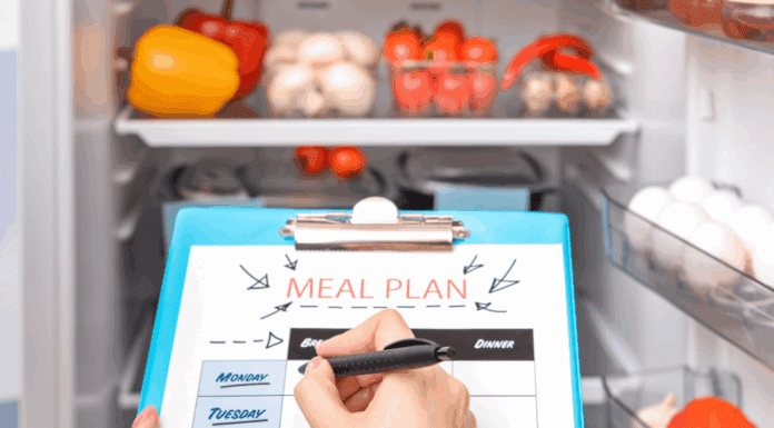 Looking into the fridge for writing a meal prep list.