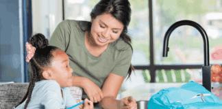 Top 10 Mistakes Parents Make When Hiring a Nanny A nanny with a child.
