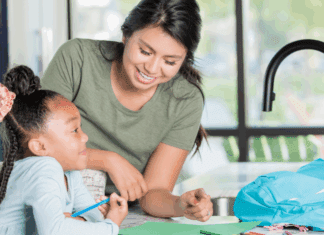 Top 10 Mistakes Parents Make When Hiring a Nanny A nanny with a child.