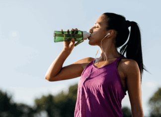 Why ‘Good Enough’ is Great: Letting Go of the Perfect Summer Workout A woman drinking water after a workout.