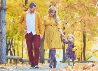 A family walking together on a fall day in one of the Westchester river towns