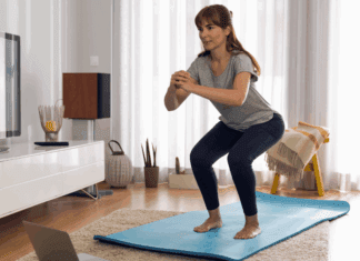 Budget-Friendly Home Workouts: Get Fit Without Breaking the Bank A woman working out on a yoga mat at home.