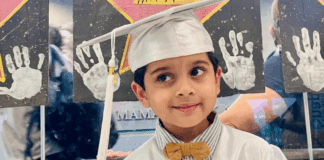 From Daycare to Kindergarten: Watching My Son Step Into a New World A little boy in his preschool graduation cap and gown.