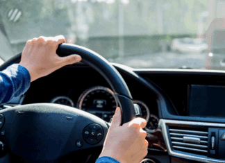 Holding a steering wheel.