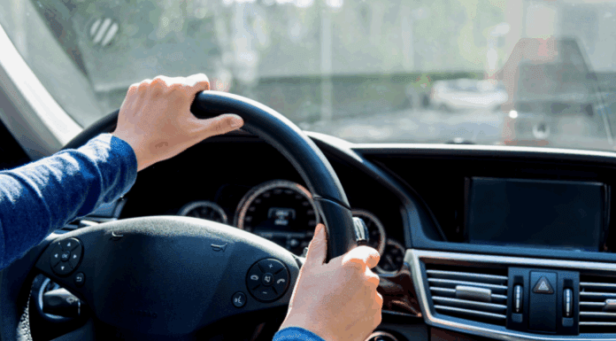 Holding a steering wheel.
